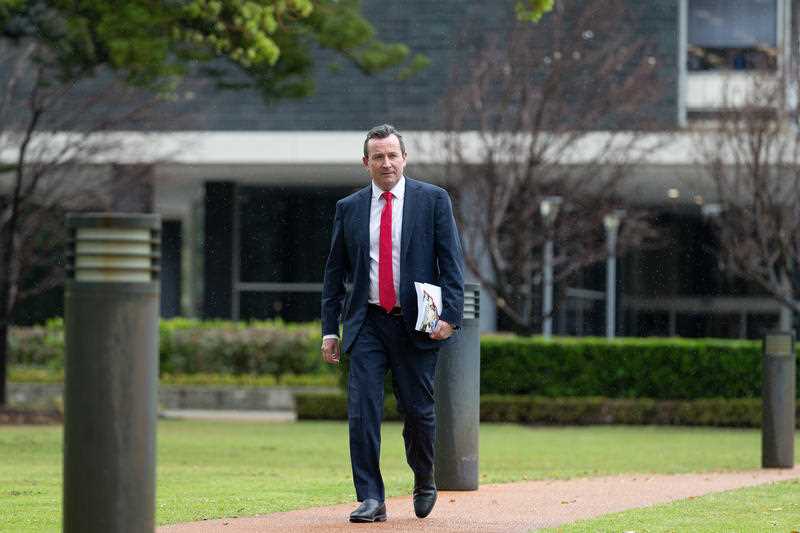 West Australian Treasurer and Premier, Mark McGowan walks to Parliament prior to delivering the WA State Budget in Perth, Thursday, September 9, 2021.