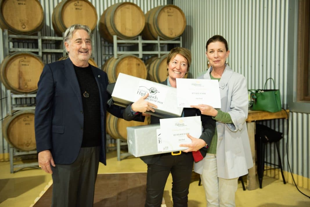 Two women and one man at wine show awards presentation