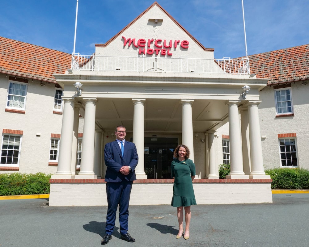 Mercure Canberra manager Lukas Wilfling and ACT Heritage Minister Rebecca Vassarotti outside the hotel. Photo provided.