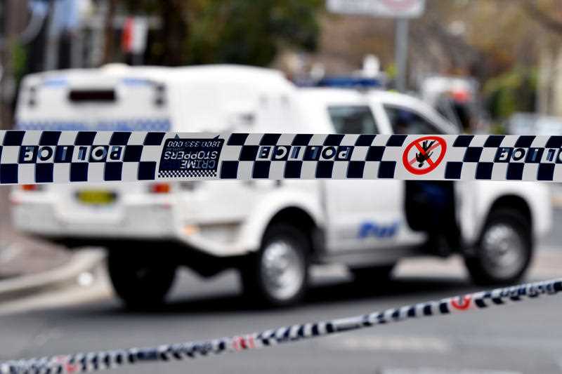 Police tape restricts access to a street in Sydney
