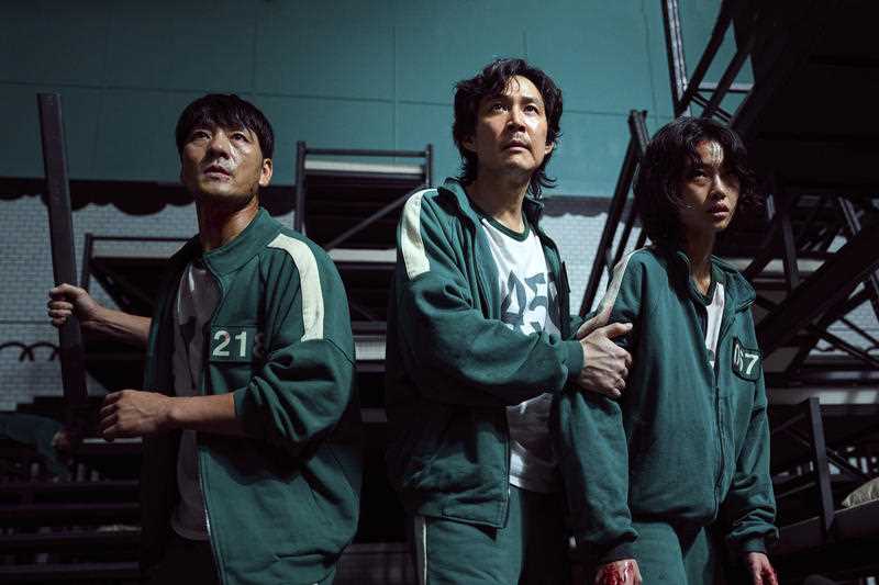 This undated photo released by Netflix shows South Korean cast members, from left, Park Hae-soo, Lee Jung-jae and Jung Ho-yeon in a scene from 