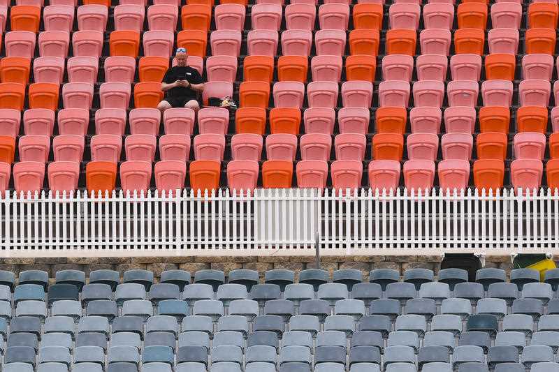 A lone spectator watches play during Day 3 of the Women’s Ashes Test Match between Australia and England at Manuka Oval in Canberra, Saturday, January 29, 2022.