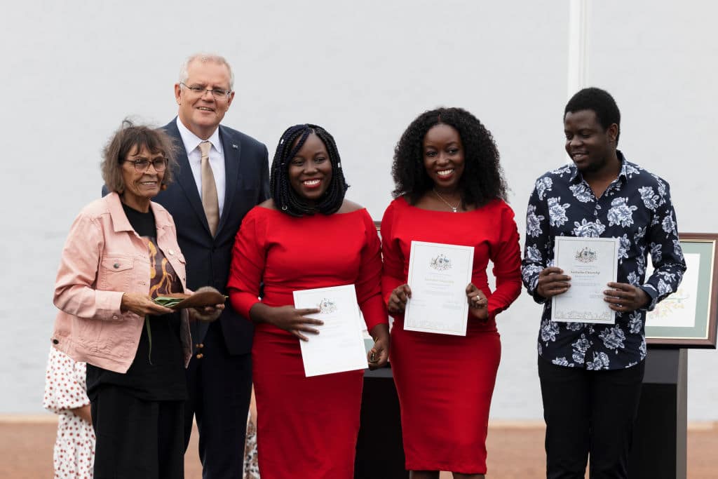 Australian Prime Minister Scott Morrison poses with Ngunnawal elder Aunty Violet Sheridan (left) and 3 new citizens at the Citizenship and Flag Raising Ceremony in Canberra.