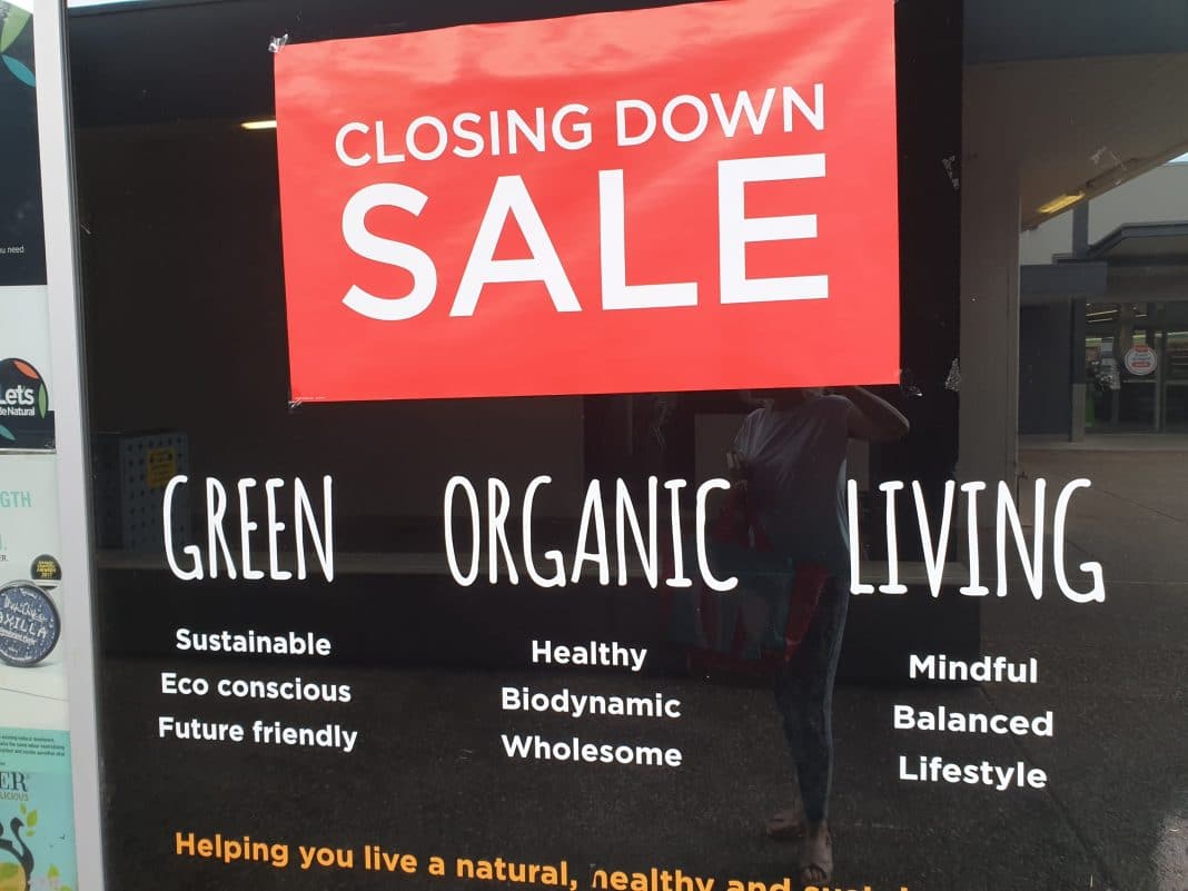 A closing down sale sign is seen in the front window of a small business in Canberra