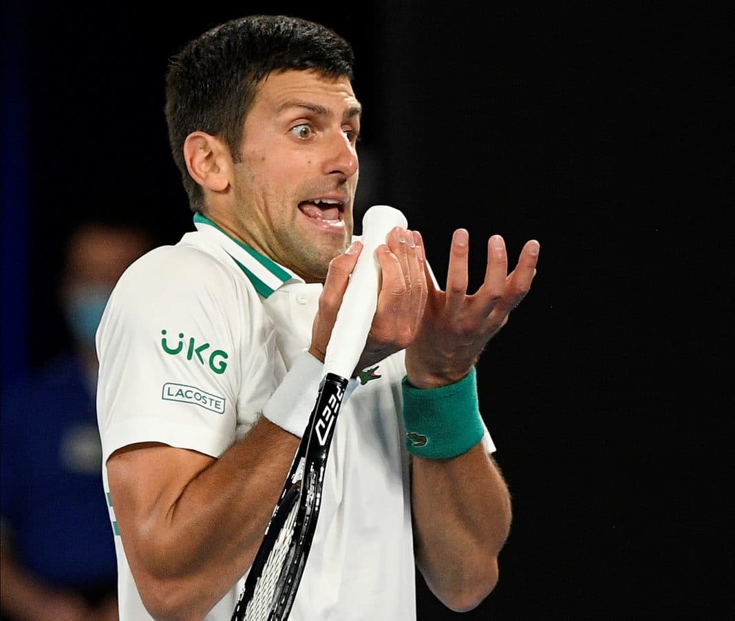 Serbia's Novak Djokovic reacts during his match against Russia's Daniil Medvedev in the men's singles final at the Australian Open tennis championship in Melbourne, Australia, Sunday, Feb. 21, 2021.(AP Photo/Andy Brownbill)