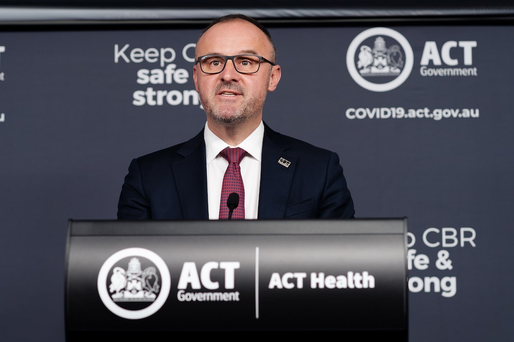 ACT chief minister Andrew Barr in suit and tie speaking at a press conference