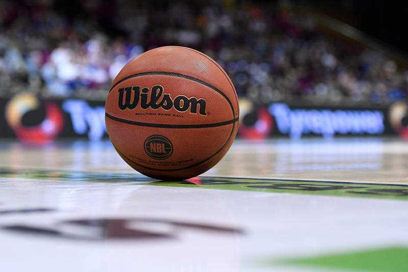 A Wilson basketball is seen on a basketball court