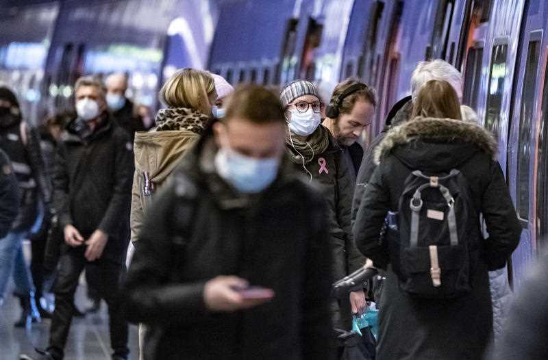 some Passengers in a train station wear masks to curb the spread of coronavirus, in Malmo, Sweden, Thursday, Jan. 7, 2021