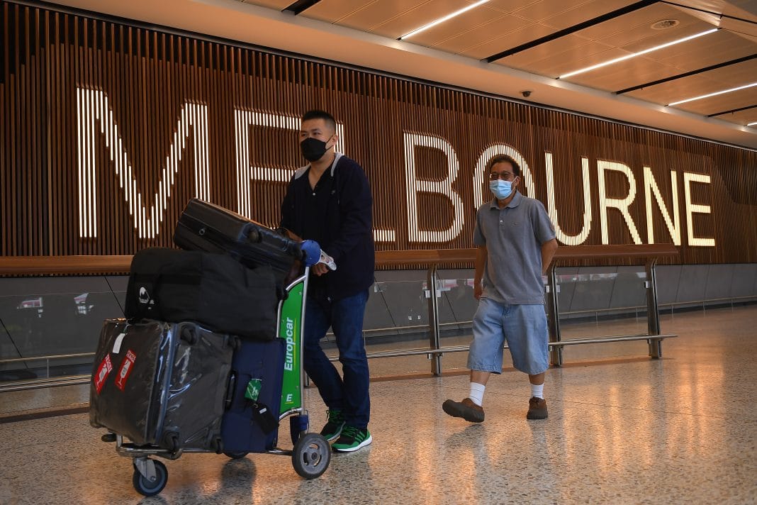 Passengers who travelled on Flight SQ237 from Singapore are seen exiting the international arrivals terminal at Tullamarine Airport in Melbourne, Monday, November 1, 2021.