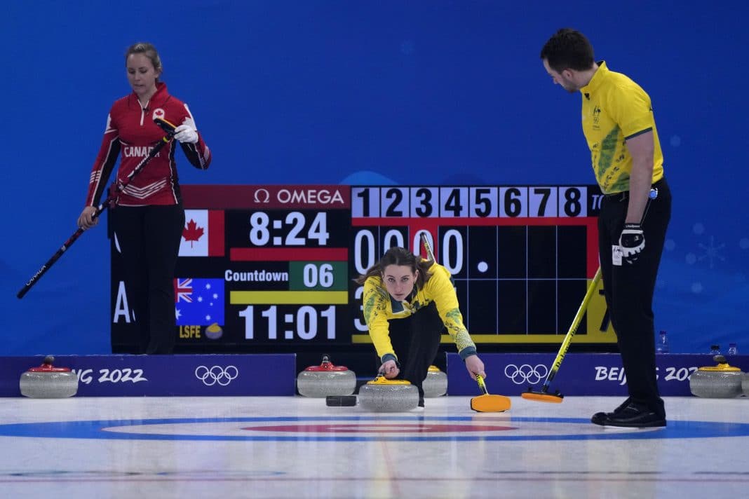 Australia's Tahli Gill, throws a rock, during the mixed doubles curling match against Canada, at the 2022 Winter Olympics, Sunday, Feb. 6, 2022, in Beijing.