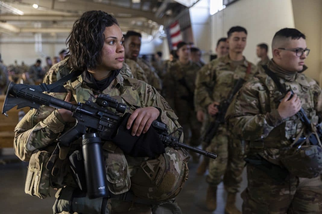 Members of the 82nd Airborne Division of the U.S. Army prepare for deployment to Poland