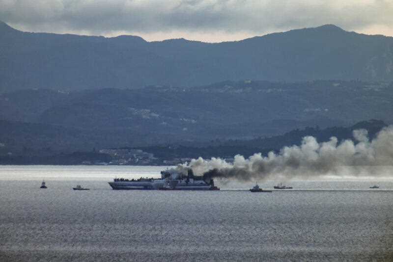 Smoke rises from the Italy-flagged Euroferry Olympia as it burns for a second day at the Ionian Sea, as it seen from an Albanian southwestern coast, Saturday, Feb. 19, 2022