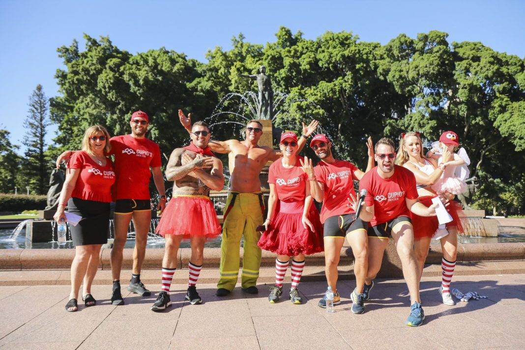 Group of 8 adults and 1 toddler dressed in Cupid's Undie Run merchandise