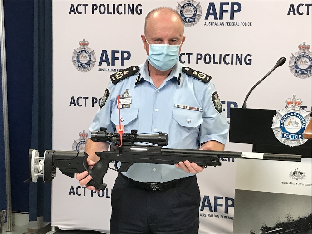 Neil Gaughan, Chief Police Officer for the ACT, holding a surrendered firearm. Photo: Nick Fuller