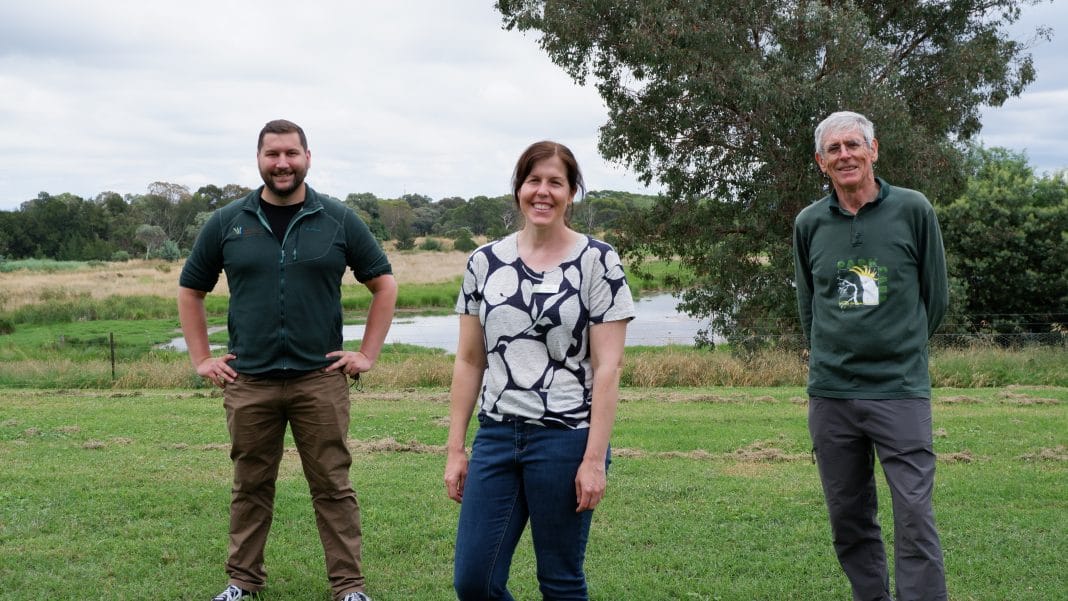 A woman and two men lead a community walk through Jerrabomberra Wetlands in Canberra