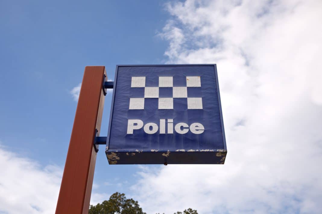 blue and white check Police sign