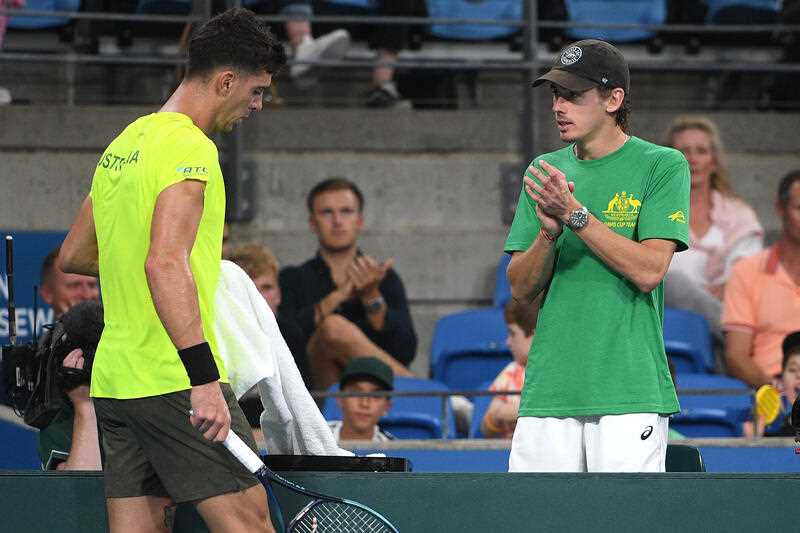 Thanasi Kokkinakis of Australia (left) is cheered on by Alex de Minaur of Australia during his Davis Cup singles match against Hungary in Sydney on 5 March 2022