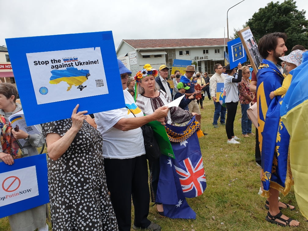several hundred protesters gather outside the Russian Embassy in Canberra bearing messages of support for Ukraine