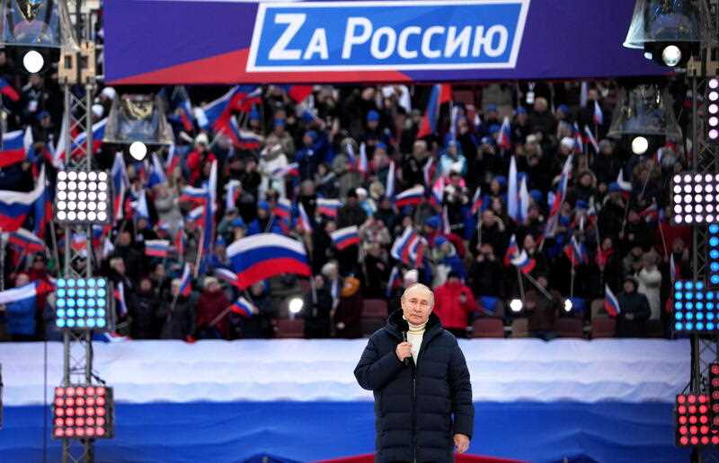 Russian President Vladimir Putin delivers a speech during a concert marking the 8th anniversary of Crimea's reunification with Russia at the Luzhniki stadium in Moscow, Russia, 18 March 2022