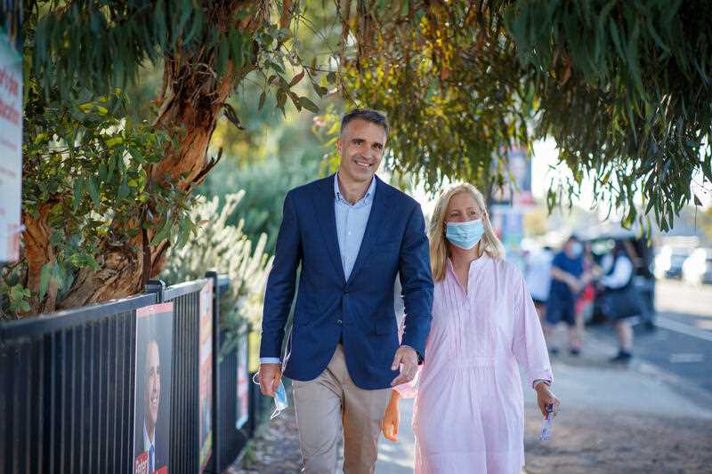 Peter Malinauskas, leader of the South Australian Branch of the Australian Labor Party, votes with his wife Annabel on polling day during the 2022 State Election at Woodville Gardens School in Adelaide, Saturday, March 19, 2022