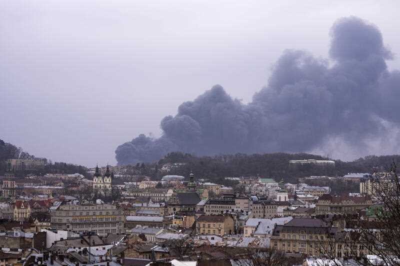 Smoke rises in the air in Lviv, western Ukraine, Saturday, March 26, 2022 as Russian forces bomb the city
