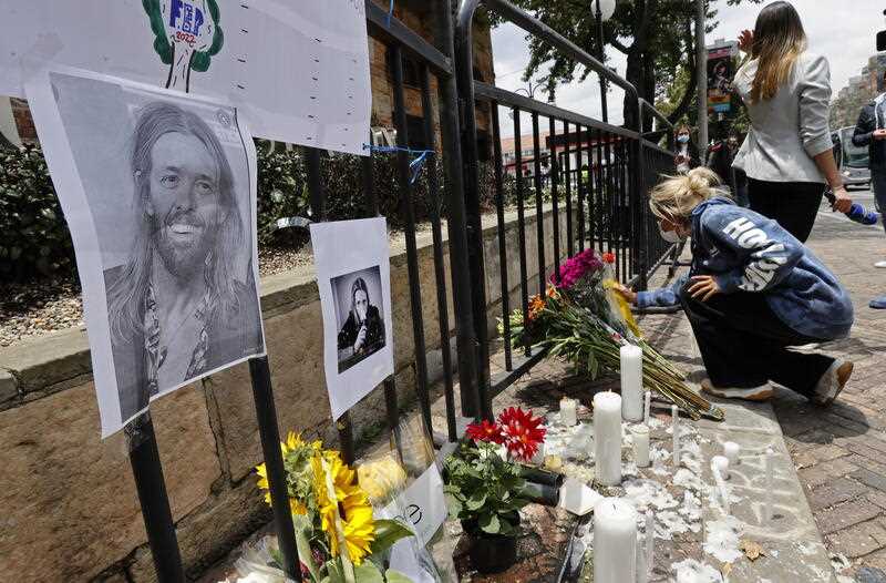 A fan of US rock band Foo Fighters ligths candles in honor of Taylor Hawkins outside Casa Medina hotel, in Bogota, Colombia, 26 March 2022