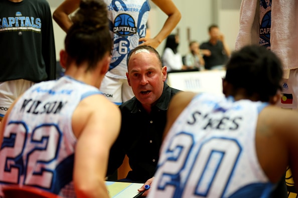 Paul Goriss head coach of the Capitals talks to his players during a time out during game one of the WNBL Finals Series between Perth Lynx and University of Canberra Capitals at Bendat Basketball Stadium, on March 24, 2022, in Perth
