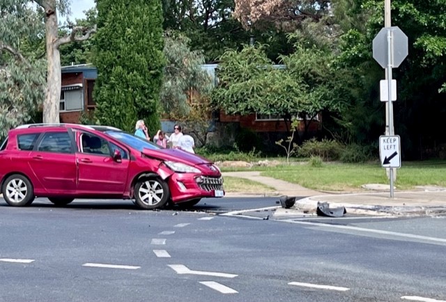 A red car damaged after a collision at a dangerous Narrabundah intersection