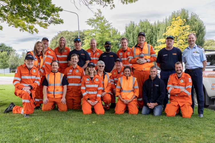 group of 18 ACT State Emergency Services men and women dressed in orange safety gear