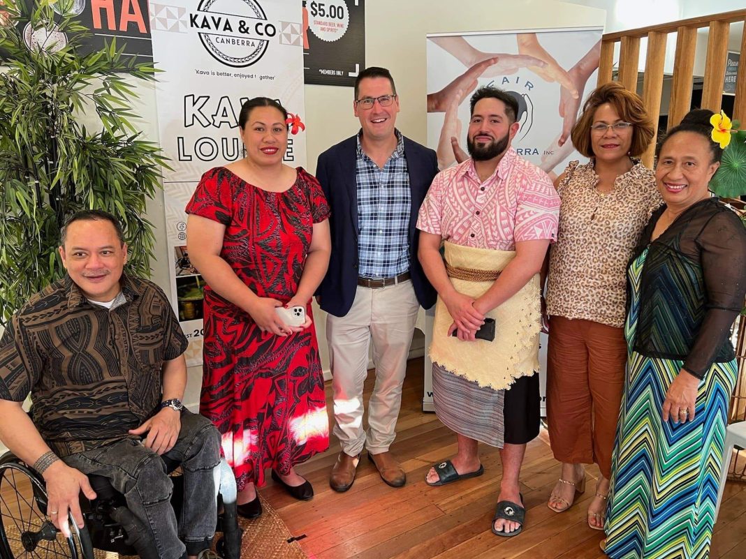Senator Zed Seselja, Minister for International Development and the Pacific, and Faonetapu Takiari, ACT community kava advocate (centre), with members of Canberra's Pacific Island community. Photo provided.