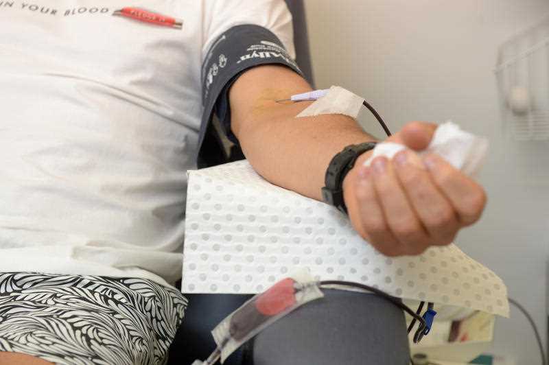 close-up of a blood donor's arm while giving blood