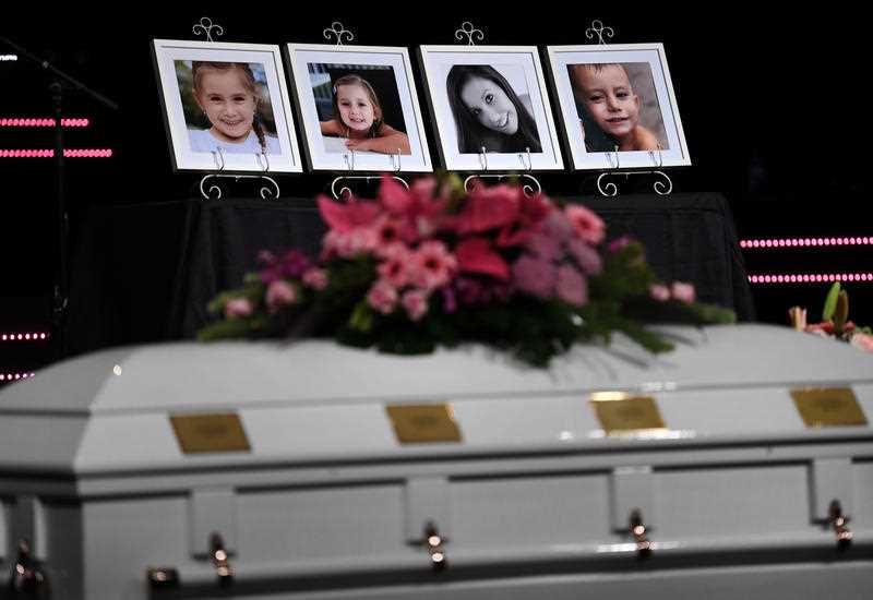 Framed photos of Hannah Clarke and her children Aaliyah, Laianah and Trey are on display during their funeral in Brisbane, Monday, March 9, 2020. Hannah and her children were murdered by their estranged husband and father