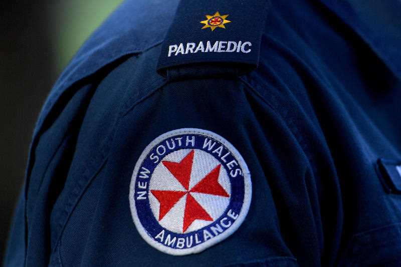 A NSW Ambulance service pacth is seen on a Paramedic