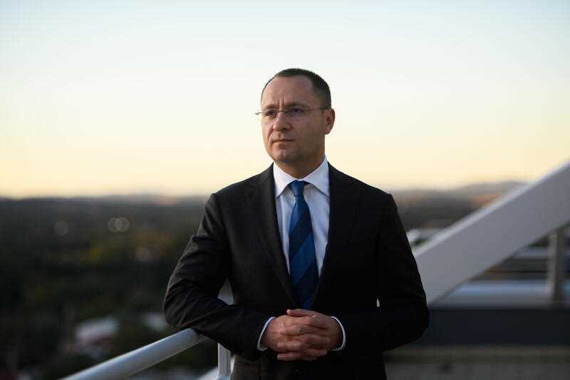 Ukraine ambassador to Australia Vasyl Myroshnychenko is seen standing on a balcony overlooking Canberra