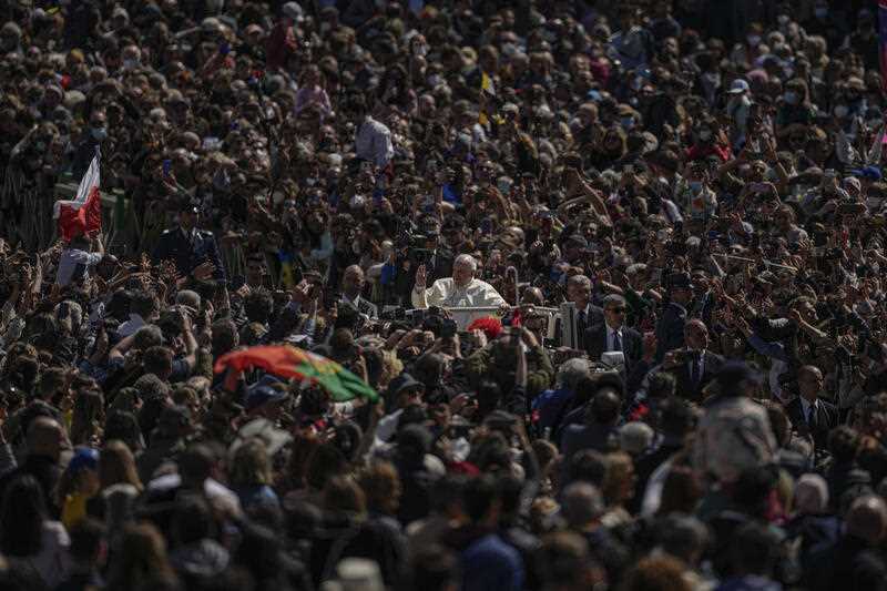 Pope Francis on his popemobile drives through the crowd of faithful at the end of the Catholic Easter Sunday mass he led in St. Peter's Square at the Vatican, Sunday, April 17, 2022.