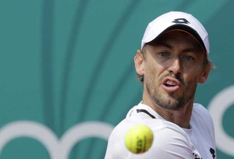 John Millman of Australia in action against Dominic Thiem of Austria during their first round match of the Serbia Open tennis tournament in Belgrade, Serbia, 19 April 2022