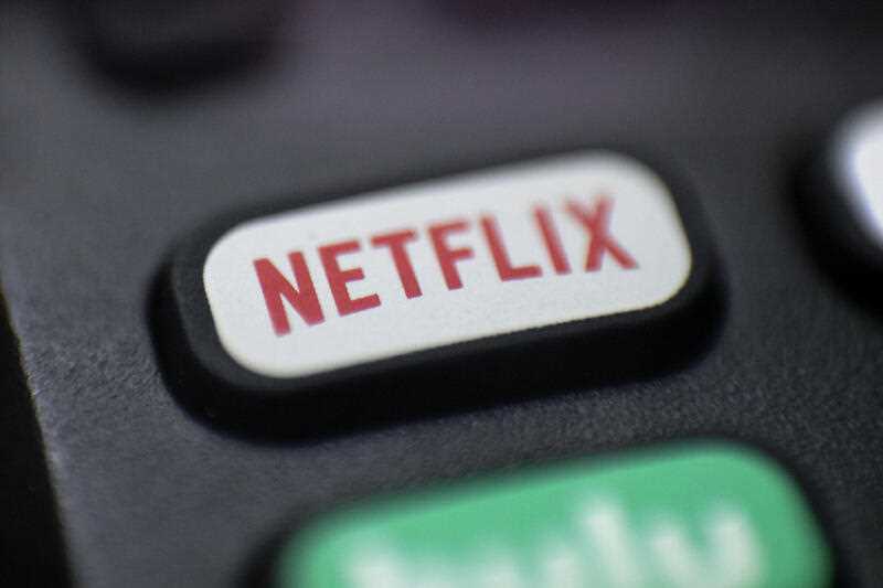 photo shows a logo for Netflix on a remote control