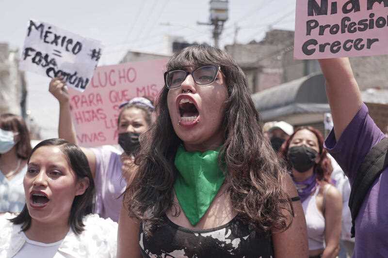Women march against the recent murders of several women, in the Mexico City suburb of Nezahualcoyotl, where two of the women were killed last week, Sunday, April 24, 2022