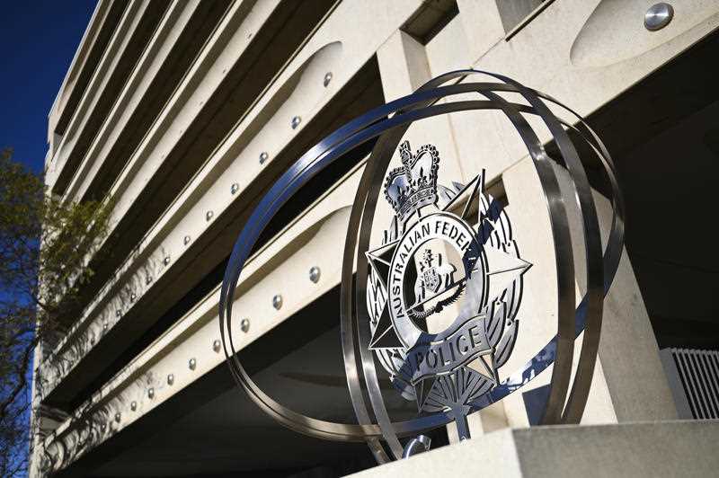 The Australian Federal Police emblem is seen outside the AFP Headquarters in Canberra