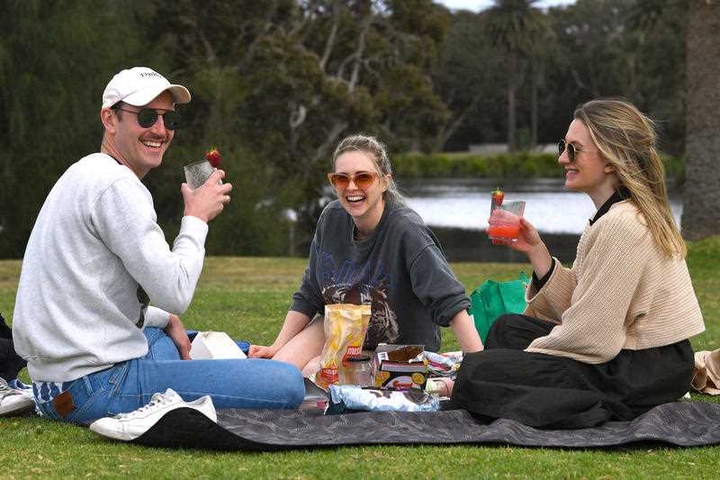 Locals gather at Centennial Park after picnic restrictions were lifted in Sydney