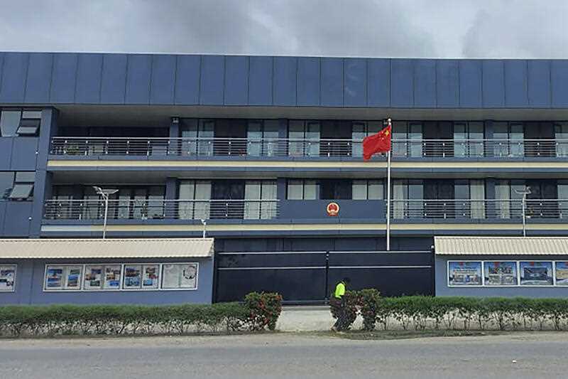 The Chinese national flag flies outside the Chinese Embassy in Honiara, Solomon Islands