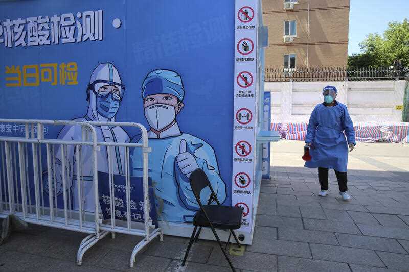 A medical staff is seen at a PCR test facility in Beijing, China on April 30, 2022, amid worries over the new coronavirus COVID-19