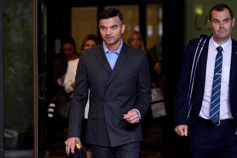 Musician Guy Sebastian leaves after giving evidence during the trial of his former manager Titus Day, at the Downing Centre District Court in Sydney, Wednesday, May 4, 2022.