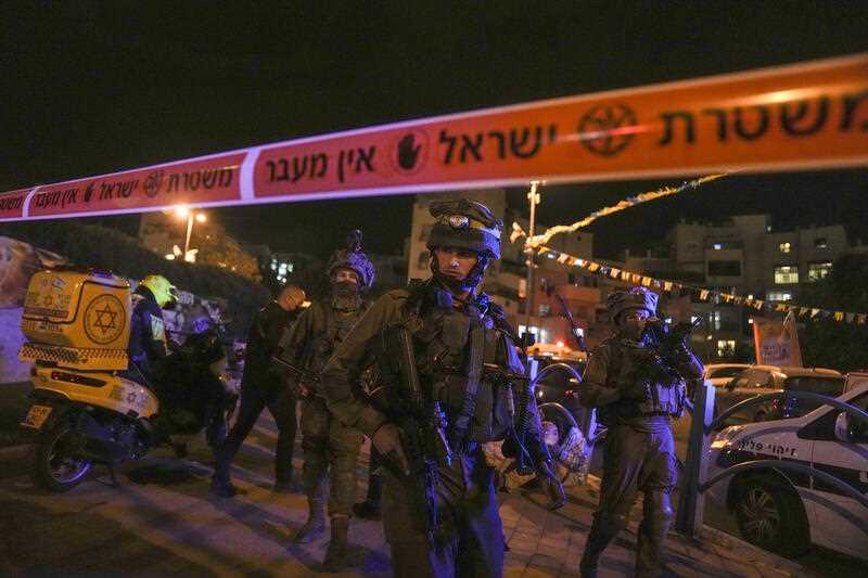 Israeli forces secure the area of a stabbing attack in the town of Elad, Israel, Thursday, May 5, 2022