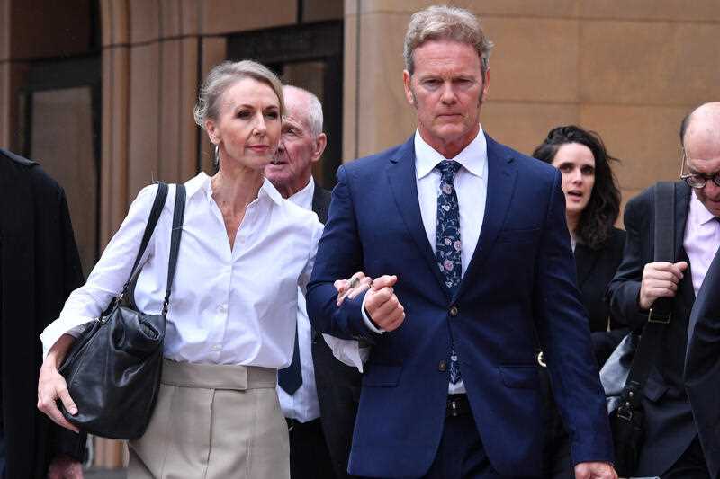 Australian actor Craig McLachlan arrives with his partner Vanessa Scammell and his legal team at the Supreme Court of New South Wales in Sydney, Monday, May 9, 2022
