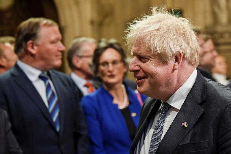 Britain's Prime Minister Boris Johnson proceeds through the Members' Lobby for the State Opening of Parliament at the Palace of Westminster in London, Tuesday, May 10, 2022