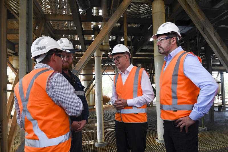 Australian Opposition Leader Anthony Albanese (centre) and shadow Industry and Innovation Minister Ed Husic (right) tour the Northern Oil Refinery on Day 32 of the 2022 federal election campaign, in Gladstone, Thursday, May 12, 2022
