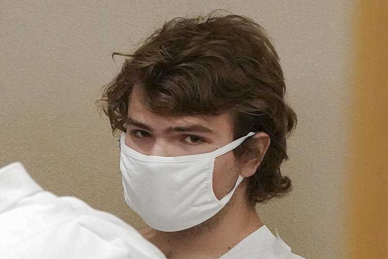 wearing a white face mask, 18 year old gunman Payton Gendron appears during his arraignment in Buffalo City Court, Saturday, May 14, 2022, in Buffalo