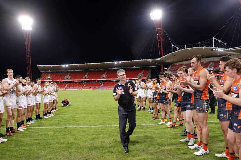 Departing Giants coach Leon Cameron is given a guard of honour by both teams after the AFL Round 9 match between the GWS Giants and the Carlton Blues at Giants Stadium in Sydney, Sunday, May 15, 2022