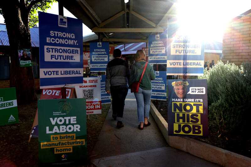 Voting placards seen outside a school polling booth on election day Saturday 21 May 2022